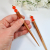 Pair of Minimalist Orange Hair Sticks, handmade by Purple Moon Designs