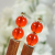 Pair of Minimalist Orange Hair Sticks, handmade by Purple Moon Designs